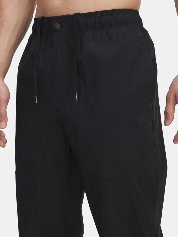 Under Armour Pánské sportovní kalhoty Under Armour UA UNSTPBLE WOVEN TX TAPER-BLK