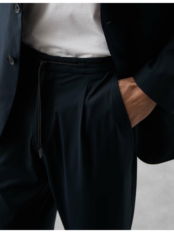 Marks & Spencer Oblekové kalhoty vhodné na cestování Marks & Spencer námořnická modrá