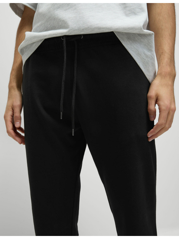 Marks & Spencer Tepláky s rovnými nohavicemi, stahovací šňůrkou a vysokým podílem bavlny Marks & Spencer černá