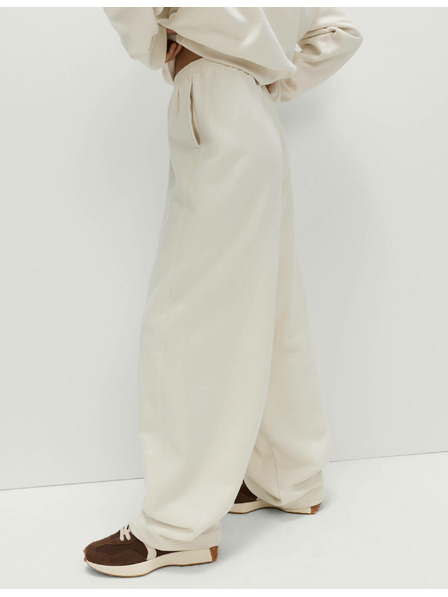 Marks & Spencer Volné tepláky z čisté bavlny Marks & Spencer smetanová